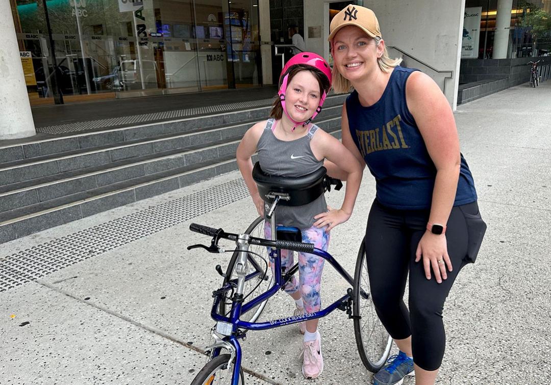 Scarlett using a running frame with mother Katrina Halliday