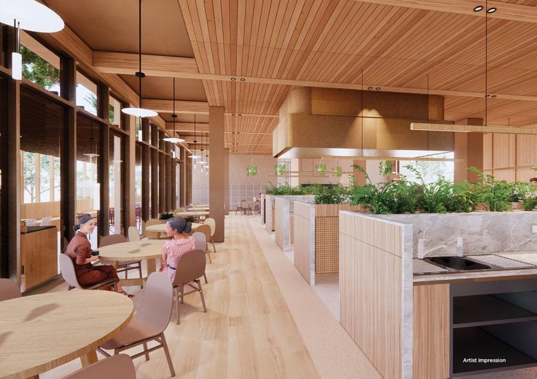 Artistic render of the student residences kitchen featuring wood panelling, indoor gardens and communal tables