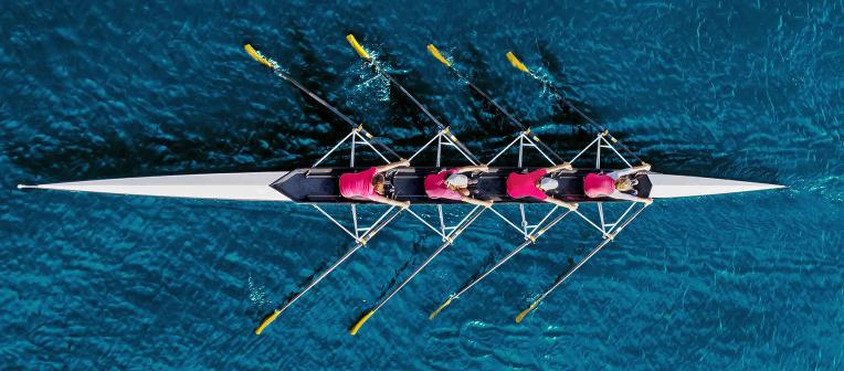 Four female rowers shot from above