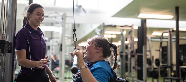 Chloe Tookey in the gym with UQ expert Bridget Dodds.