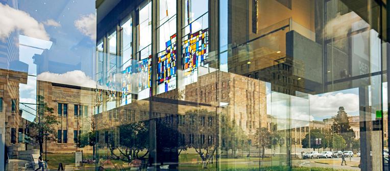 Forgan Smith Building at UQ reflected in the glass wall of Mayne Hall