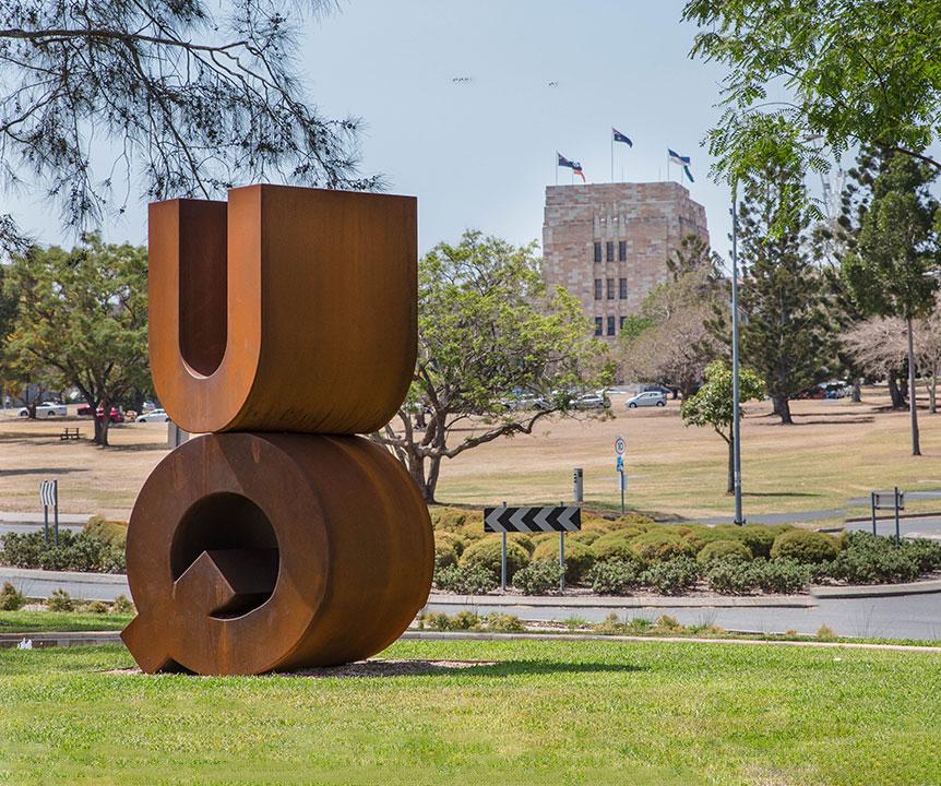 uq signage sandstone building