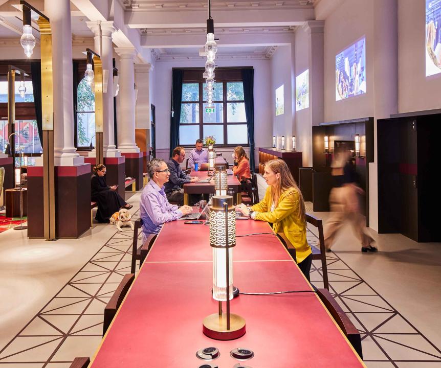 long table with people sitting at it