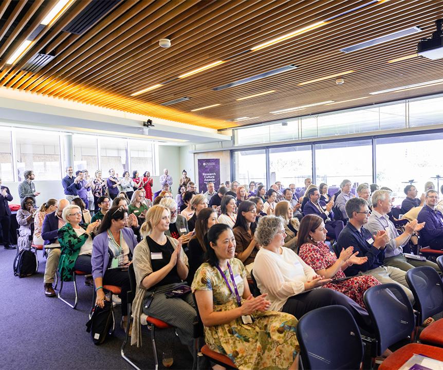 A seated audience at an event in the Terrace Room