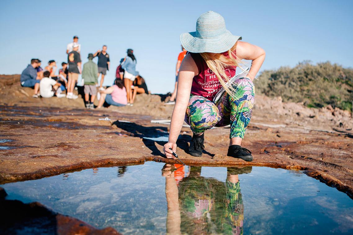 Indigenous student exploring rockpool biology