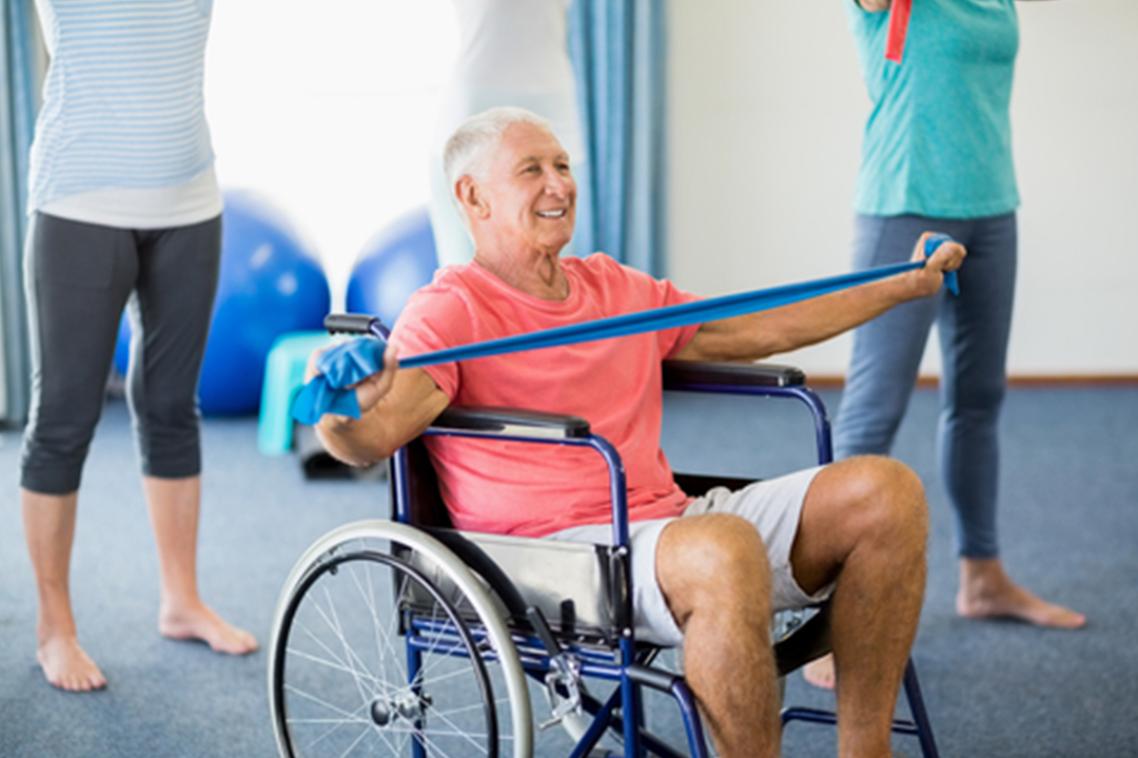 Man in wheelchair performing modified version of exercise