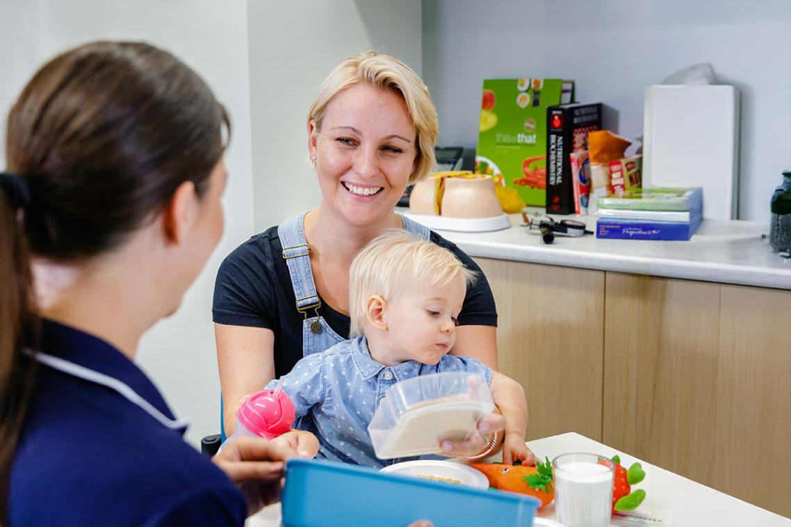 A mother and toddler in a UQ nutrition clinic