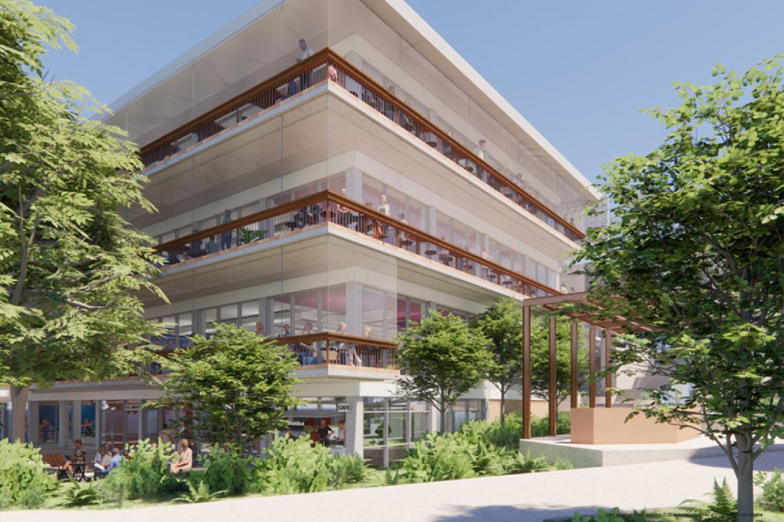 Outside of building 21C with pathways and trees and plants.