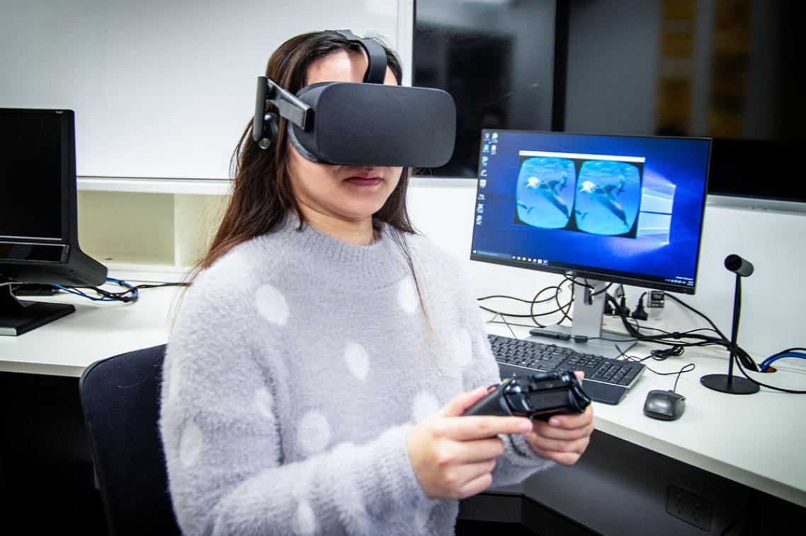 Person wearing VR headset participating in an experiment.