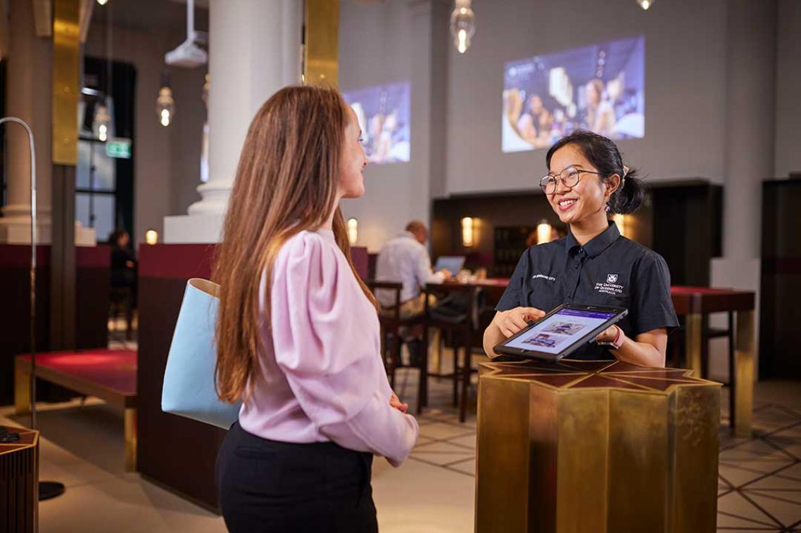 Woman being welcomed by 308 Queen Street concierge