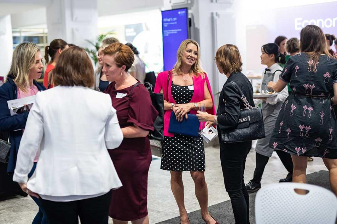 groups of women talking at an event