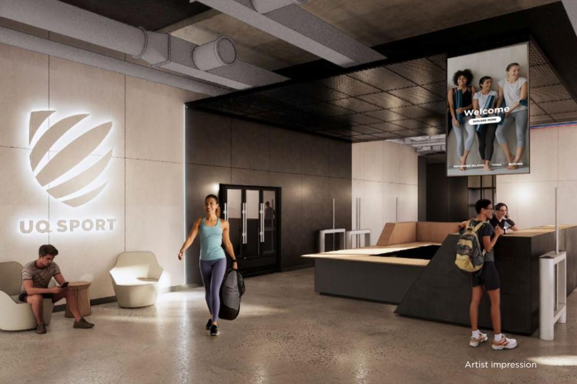 A spacious, modern reception area with backlit UQ Sport logo on the wall. Thee people are in shot, wearing activiwear.
